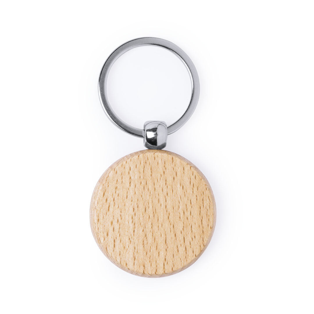 llavero de madera de forma circular con argolla de metal sobre fondo blanco