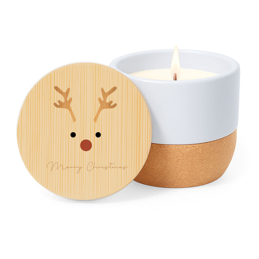 Vela aroma de lino con tarro de cerámica y base de corcho. Tapa de bambú con dibujo minimalista navideño de un reno y la frase Merry Christmas