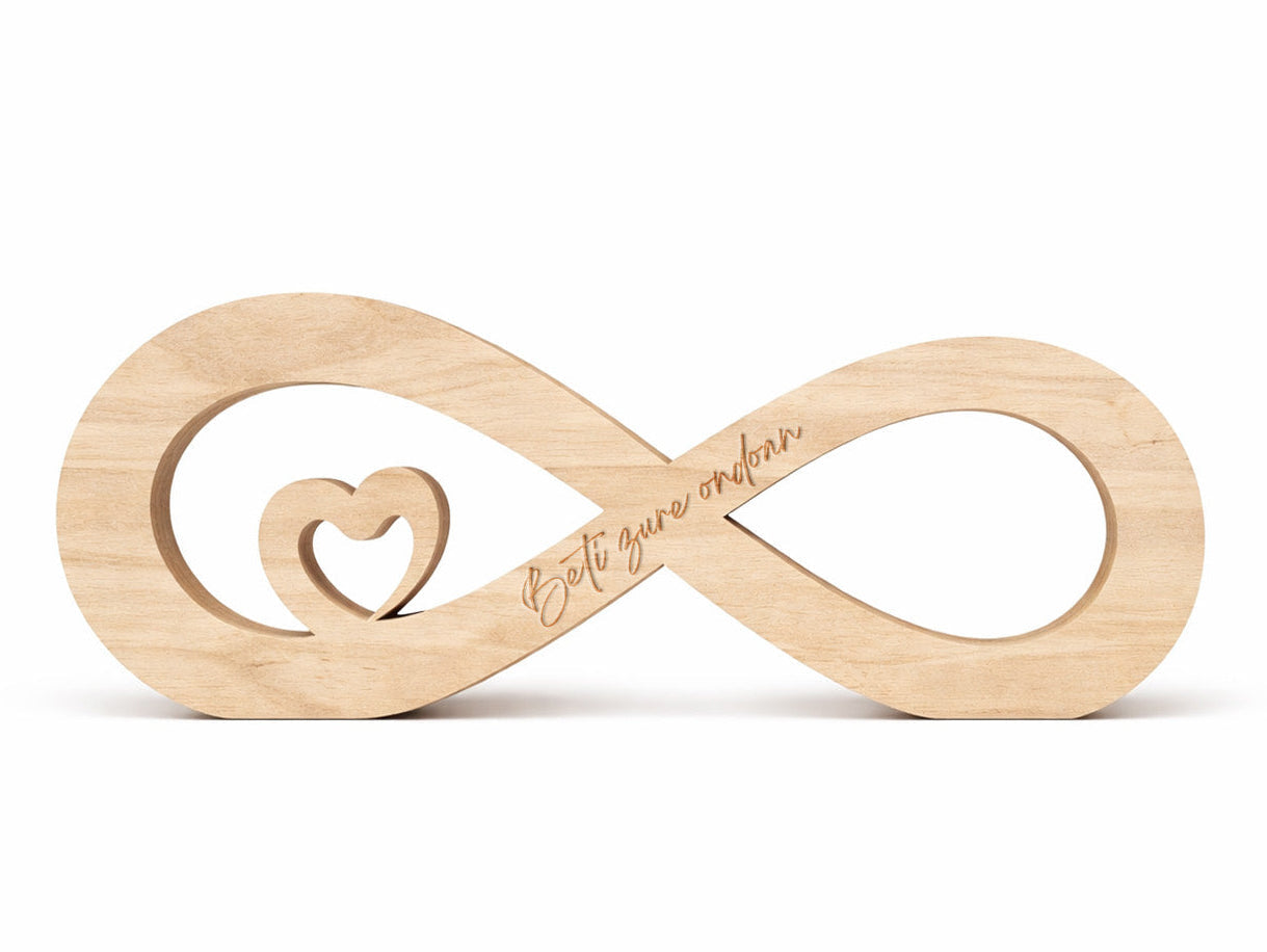 Figura decorativa de madera de haya natural en forma de infinito con un pequeño corazón en su interior y un mensaje grabado a láser ideal para el día de san valentín. Regalo para enamorados. Beti zure ondoan