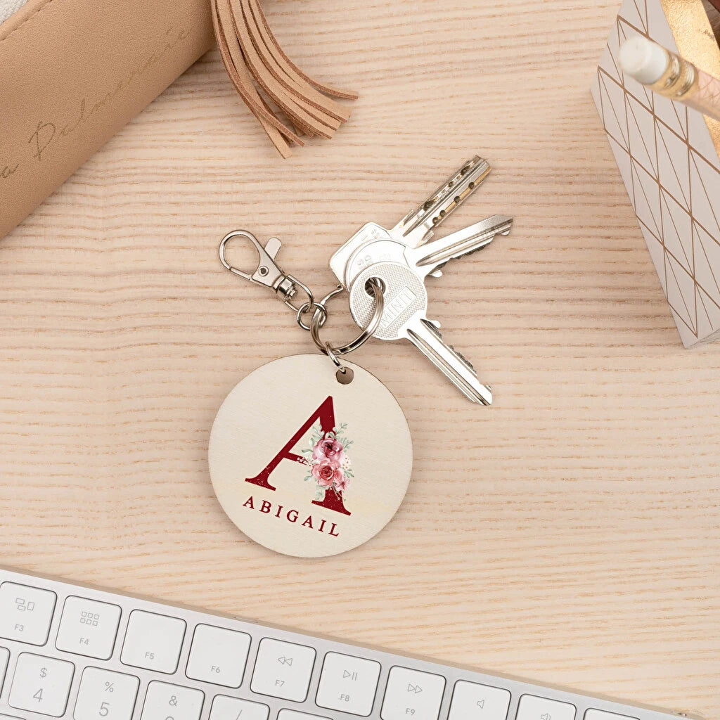 Llavero de madera natural personalizado mediante impresión directa con el diseño del cliente. Forma redonda